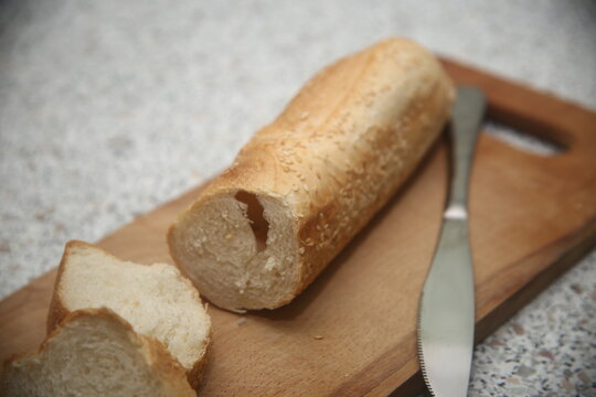 sliced bread with knife on a cutting board
