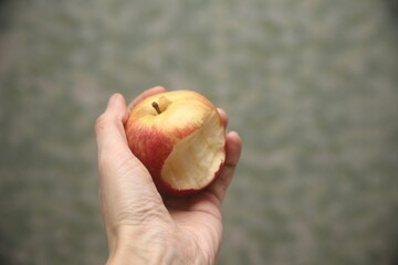 hand holding apple