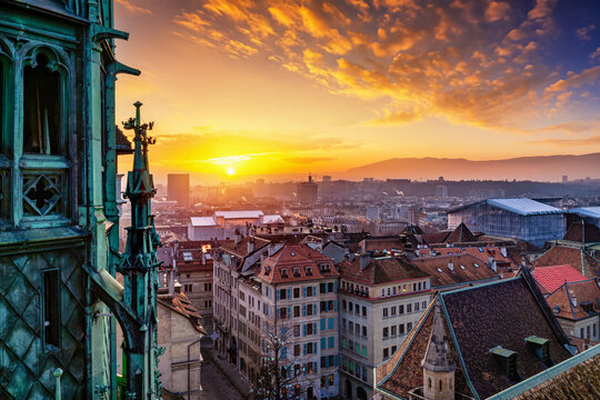 Elevated winter sunset view of the city skyline of Geneva, Switzerland, seen from the Saint Pierre Cathedral