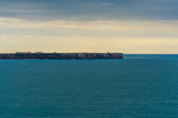 Cape St. Vincent and its buildings sit atop a dramatic headland above the ocean.