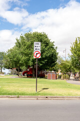 one way street sign on the road
