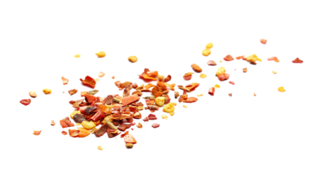 Close up spicy chili red pepper flakes, chopped, milled dry paprika pile isolated on white background, side view