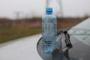 Empty plastic bottle flagon thrown into nature