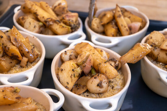 High cuisine cooking experince with chef in cook studio in Paris, oven baked vegetarian dish with vegetables, truffle mushrooms, cheese, black salsify, mousse and nuts