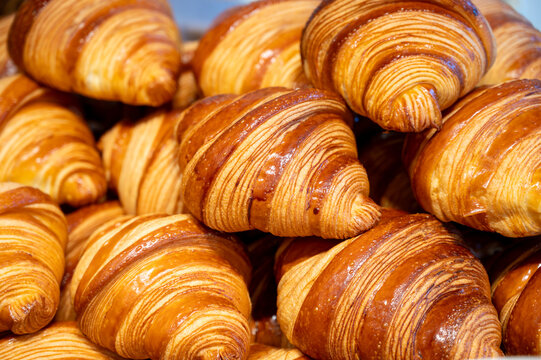 Breakfast in France, fresh baked butter croissants pastries in artisanal bakery in Paris, France, close up