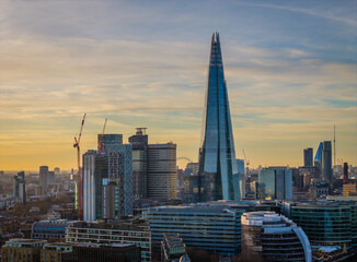 Aerial drone view of The Shard in London skyline - iconic skyscraper rising above the city panorama during a sunset