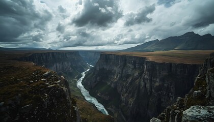 Dramatic Mountain Canyon with River Under Stormy Cloudy Sky