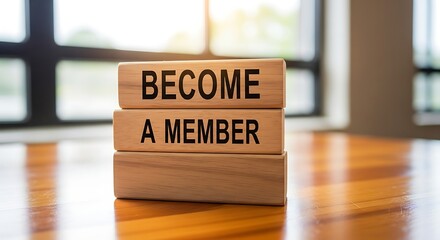 Wooden blocks spelling BECOME A MEMBER on a wooden table, symbolizing community and exclusive access.