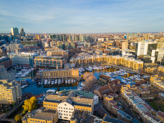 St Katharine Docks. Aerial drone view of Saintt Katharine Docks in London - historic marina, yachts and modern city architecture