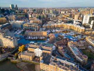 St Katharine Docks. Aerial drone view of Saintt Katharine Docks in London - historic marina, yachts and modern city architecture