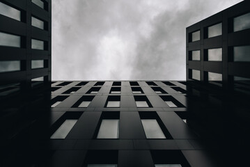 Modern Minimalist Architecture With Symmetrical Windows and Cloudy Sky