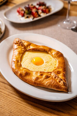Traditional Georgian Khachapuri With Egg And Cheese