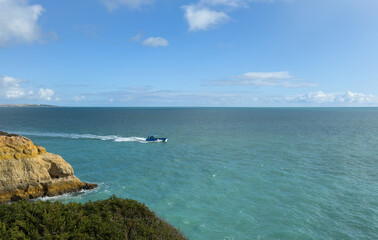 Naklejka premium Coast cliff island sea ocean ship