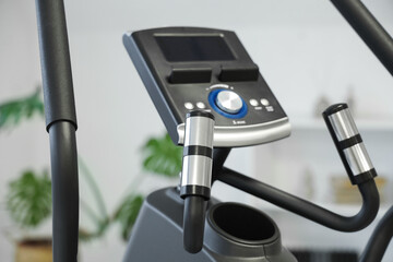 Obraz premium Panel of modern exercising bike in stylish room, closeup