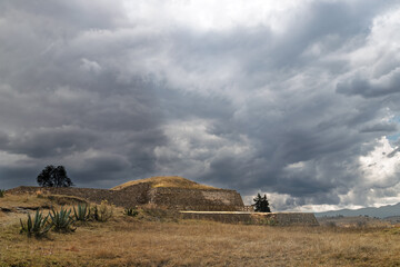 Ancient Tlaloc temple pyramid ruins under stormy sky in Calixtlahuaca, Mexico