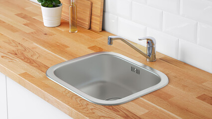 Modern kitchen sink and faucet on wooden countertop with potted plant and kitchen tools in view.