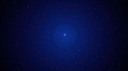 Obraz premium Dark Blue Night Sky Filled with Glimmering Stars Twinkling Brightly in the Distance Creating a Vast and Tranquil Cosmic Scene