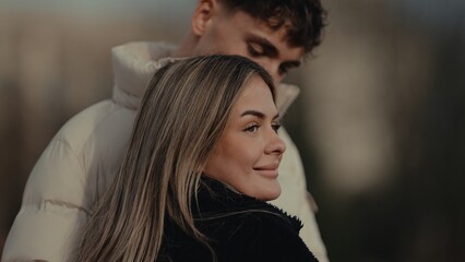 A young couple embraces affectionately in Paris France The image captures a romantic moment between...