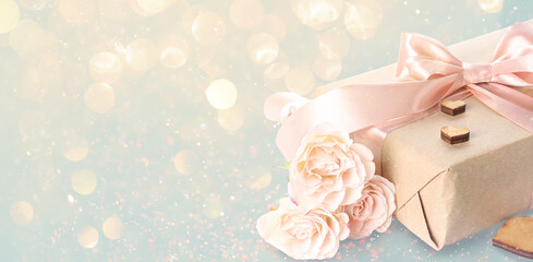 Gift box with hearts and roses for Valentine's Day on white background