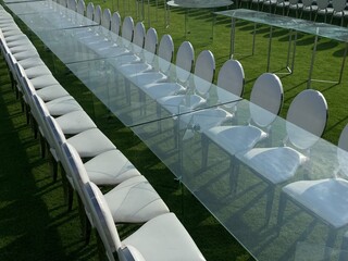 Outdoor party tables on green grass, weddings, events, companies