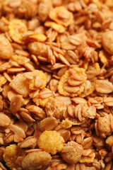 Fototapeta premium Pile of tasty granola as background, closeup