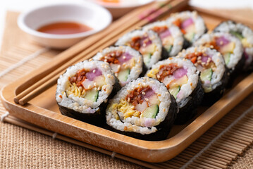 Kimbap, Korean food made from cooked rice with vegetables, egg and wrapped with dried seaweed 