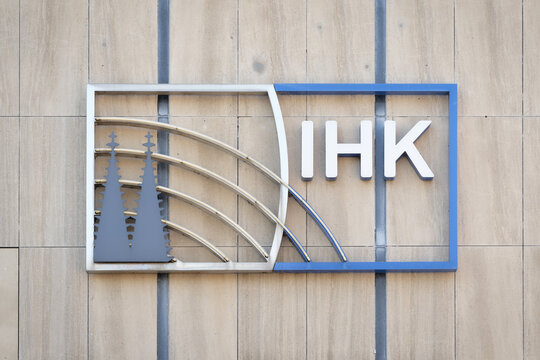 Cologne, Germany July 29 2024: Official IHK Cologne sign on a stone facade featuring the stylized twin towers of the Cologne Cathedral. Professional business and institutional exterior