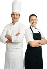 Two chefs a man in a tall white toque and jacket and a woman wearing a black apron and white chef coat stand back to back with arms crossed smiling confidently cooking culinary