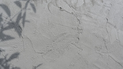 Cement Wet Plaster wall Background, Concrete rough texture construction building site house wall structure pattern well material design beton gray loft shadow light free space for text background.