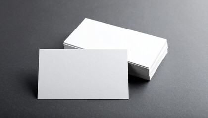 Blank Business Card Stack Mockup on a dark gray background
