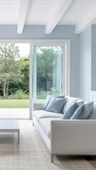 Bright Minimalist Living Room With White Sofa, Blue Walls, and Large Garden View Window