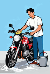 Young man washes his red motorcycle with a sponge and soapy water