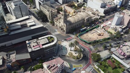 Aerial view Lima roundabout business district, drone sweeps across busy intersection with multilaned - Powered by Adobe