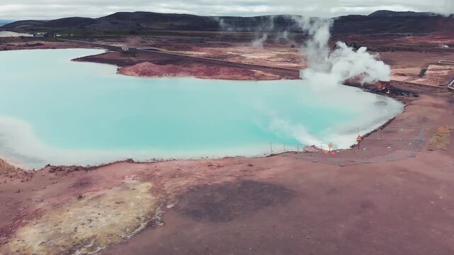 Hot geothermal pool of Hverir Myvatn Lake. Iceland blue water steam, aerial view