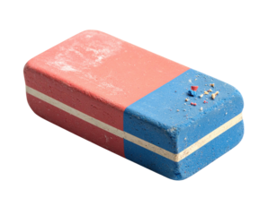 A classic red and blue rectangular eraser with a white stripe. The surface is worn and shows dust and small shavings from use.