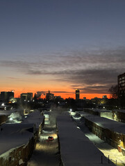 The silhouette of the city at sunset. The shadows of the houses, the warm light of the sun over the horizon. Novosibirsk 2025