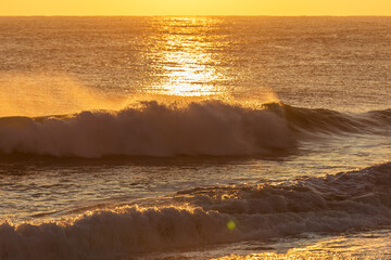 Breaking Waves in Golden Sunrise Light