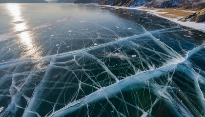 Stunning close-up of intricate cracks in a frozen lake surface under natural light.