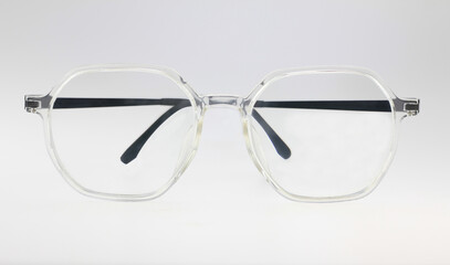 clear eyeglasses transparent frame glasses, eye care, optometry and fashion concept with black temples, transparent hexagonal frames and black temples vision  eye care, isolated on white background 