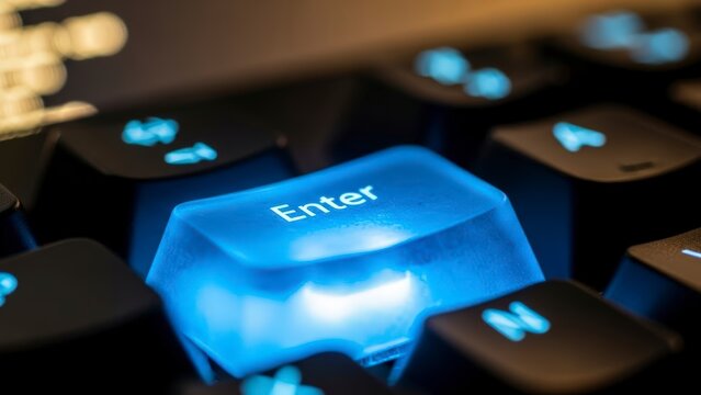 Close-up of a glowing blue Enter key on a dark computer keyboard. - Powered by Adobe