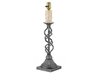 Elegant metal candlestick holder with white candle on black background