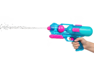 Hand holding blue and pink toy water gun on black background