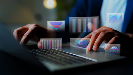 Big data analytics concept with businessman working on laptop, analyzing financial charts, highlighting business development, growth, and strategic planning.