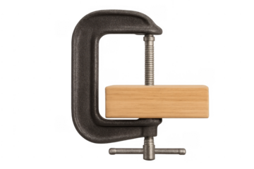 G-clamp holding a wooden block on transparent background