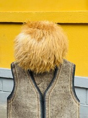Traditional Georgian outfit featuring a fur hat and warm vest, worn by locals, showcasing cultural heritage and classic clothing from Sakartvelo (Georgia)