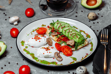 Baguette with guacamole, champignons mushrooms and micro green on white plate. Brunch ideas. Vegan protein source. healthy food. clean eating.