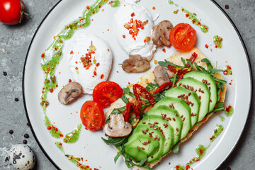 Baguette with guacamole, champignons mushrooms and micro green on white plate. Brunch ideas. Vegan protein source. healthy food. clean eating.
