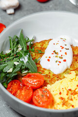 delicious potato pancakes with mushrooms and sausage