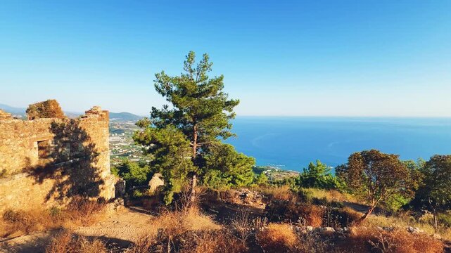 Ruins of the ancient Roman port city of Siedra in Alanya, Antalya, Turkey. The street and ruins of the ancient abandoned ancient city of Siedra on the Mediterranean coast. 4К