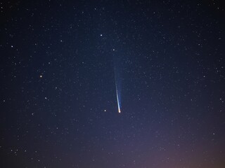 Shooting star in night sky